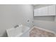 Functional laundry room with built-in storage and a utility sink at 501 Ivyshaw Rd, Cary, NC 27519