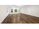 Spacious living room featuring beautiful hardwood floors, a ceiling fan, and great light from the windows at 501 Ivyshaw Rd, Cary, NC 27519