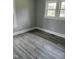 Bright bedroom with laminate flooring and white trim, creating a clean and inviting space at 501 Morgan Ter, Burlington, NC 27217
