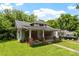Front view of a single-story fixer-upper with a covered porch in need of extensive repairs at 503 Edwards Dr, Chapel Hill, NC 27516