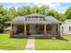 Dilapidated single-story home featuring a covered front porch needing significant repairs at 503 Edwards Dr, Chapel Hill, NC 27516