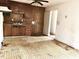 Functional kitchen space with wood cabinets, a double basin sink, and adjacent open area at 525 Locust Rd, Hillsborough, NC 27278