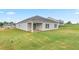 Wide backyard with a covered patio and new sod, perfect for outdoor activities at 528 Lochalsh Dr, Gibsonville, NC 27249
