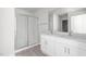 Bright bathroom featuring a double vanity, chrome fixtures, and a glass enclosed shower at 528 Lochalsh Dr, Gibsonville, NC 27249