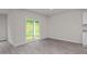 Bright dining area featuring sliding glass doors to the backyard and sleek, modern flooring at 528 Lochalsh Dr, Gibsonville, NC 27249