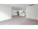 Open-concept floor plan featuring a living room area adjacent to the bright modern kitchen at 528 Lochalsh Dr, Gibsonville, NC 27249