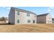 Back exterior of home showcasing a spacious backyard and vinyl siding at 597 Leven Dr, Gibsonville, NC 27249
