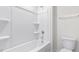 Bathroom with tub-shower combination, toilet, and towel bar at 597 Leven Dr, Gibsonville, NC 27249