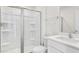 Modern bathroom featuring a glass-enclosed shower, sleek vanity, and bright, clean finishes at 597 Leven Dr, Gibsonville, NC 27249