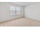 Carpeted bedroom with a large window lets in natural light at 597 Leven Dr, Gibsonville, NC 27249