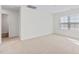 Spacious bedroom with plush carpeting and large window, offering bright natural light and comfort at 597 Leven Dr, Gibsonville, NC 27249