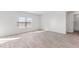 Serene bedroom showcasing a large window offering ample natural light and neutral decor at 597 Leven Dr, Gibsonville, NC 27249