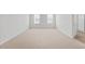Expansive bedroom with neutral carpeting, dual windows, and an attached bathroom for added privacy at 597 Leven Dr, Gibsonville, NC 27249