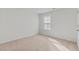 Bright, carpeted bedroom showcases neutral decor, offering a blank canvas for personalization at 597 Leven Dr, Gibsonville, NC 27249