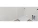 Practical laundry room featuring hookups and a drain pan on laminate flooring at 597 Leven Dr, Gibsonville, NC 27249