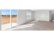 The open concept living room offers sliding door access to the home's exterior at 597 Leven Dr, Gibsonville, NC 27249
