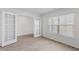 The Living Room features French doors, plenty of natural light, and laminate flooring at 597 Leven Dr, Gibsonville, NC 27249