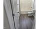 Bathroom featuring vinyl floor and white tub-shower combo at 6408 Bunker Hill Dr, Raleigh, NC 27610