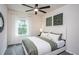 Cozy bedroom with a plush bed, stylish decor, and a large window, creating a peaceful and inviting retreat at 668 Ben Ledi Ct, Raleigh, NC 27603