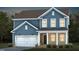 Charming two-story home with blue siding, white trim, and a cozy front porch and a two car garage at 668 Ben Ledi Ct, Raleigh, NC 27603