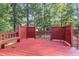 Outdoor deck with bench seating, ideal for entertaining or relaxing in a private setting at 716 Beddingfield Dr, Knightdale, NC 27545