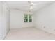 Bright bedroom featuring a ceiling fan and closet space with a window view at 716 Beddingfield Dr, Knightdale, NC 27545