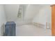 Attic room features built-in shelving, dormer window, carpet, and an angled ceiling at 716 Beddingfield Dr, Knightdale, NC 27545