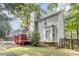 Exterior view of home featuring a bay window, chimney, and red deck with access to the fenced backyard at 716 Beddingfield Dr, Knightdale, NC 27545