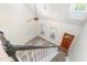 Bright foyer with wood-look floors, wooden front door and stair access to the upper level at 716 Beddingfield Dr, Knightdale, NC 27545