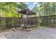 Backyard has a charming gazebo with wood railing and steps, surrounded by decorative gravel at 716 Beddingfield Dr, Knightdale, NC 27545