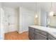 Bright eat-in kitchen features painted cabinets, white countertops, and a door leading outside at 716 Beddingfield Dr, Knightdale, NC 27545
