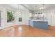 Eat-in kitchen with white cabinets, an island with seating, and stainless steel appliances at 716 Beddingfield Dr, Knightdale, NC 27545
