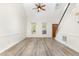 Bright and spacious living room featuring hardwood floors, high ceilings, and a staircase at 716 Beddingfield Dr, Knightdale, NC 27545