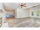 Spacious living room with vaulted ceilings, ceiling fans, and an open floor plan into the kitchen at 716 Beddingfield Dr, Knightdale, NC 27545