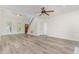 Spacious living room featuring hardwood floors, high ceilings, a staircase, and natural light at 716 Beddingfield Dr, Knightdale, NC 27545