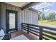 Charming balcony with dark wood railings, comfortable seating, and a view of the neighborhood at 931 Ramseur St, Durham, NC 27701