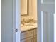 Bathroom featuring a decorative mirror, granite countertop and stylish fixtures at 931 Ramseur St, Durham, NC 27701