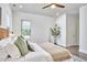 Bedroom with hardwood floors, decorative mirror, and bright natural lighting at 931 Ramseur St, Durham, NC 27701