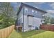 View of the home's exterior showing a two-story design and well-maintained lawn at 931 Ramseur St, Durham, NC 27701