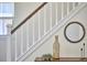 Bright stairway featuring white railing and charming decorative accents at 931 Ramseur St, Durham, NC 27701