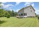 Spacious fenced backyard with a well-maintained lawn and deck at 1020 Regency Cottage Pl, Cary, NC 27518