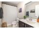 Stylish bathroom featuring a vanity with a sink, a mirror, and a shower with a striped curtain at 1020 Regency Cottage Pl, Cary, NC 27518