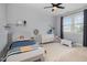 Light-filled bedroom with a window, neutral walls, and fun decor at 1020 Regency Cottage Pl, Cary, NC 27518