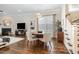 Cozy dining area with round wood table and stylish seating, located off of the living room at 1020 Regency Cottage Pl, Cary, NC 27518