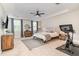 This main bedroom offers a ceiling fan, multiple windows and a sitting area at 1020 Regency Cottage Pl, Cary, NC 27518