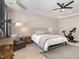 Relaxing main bedroom with a ceiling fan, warm lighting, and cozy chair at 1020 Regency Cottage Pl, Cary, NC 27518