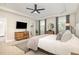 Bright main bedroom with a wooden dresser, walk-in closet, and large windows at 1020 Regency Cottage Pl, Cary, NC 27518