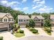 View of the well-maintained neighborhood street with beautiful homes and mature trees at 1020 Regency Cottage Pl, Cary, NC 27518
