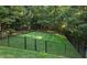Lush backyard featuring a freshly cut lawn and surrounded by a metal fence at 1028 Harpers Ridge Ct, Wake Forest, NC 27587