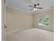 Comfortable bedroom with neutral decor, carpet, and a large window offering natural light at 1028 Harpers Ridge Ct, Wake Forest, NC 27587